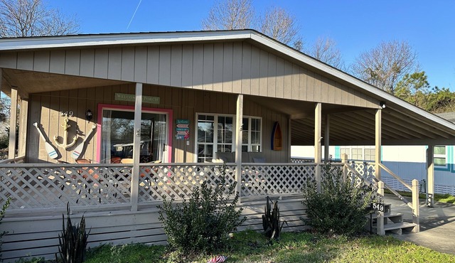 Coastal cottage minutes from the beach. Large front porch for morning sun!