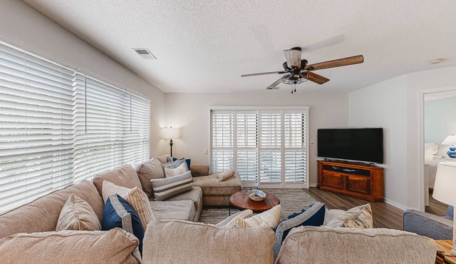 Coastal resort condo with on-site pools, hot tub, game room, & golf