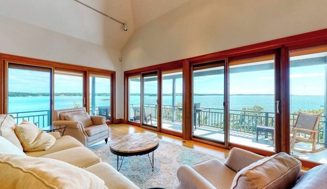 Delightful oceanfront home with amazing views, wrap-around deck & two fireplaces