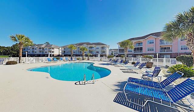Dual-suite Magnolia Pointe condo with golf, pools, and screened patio