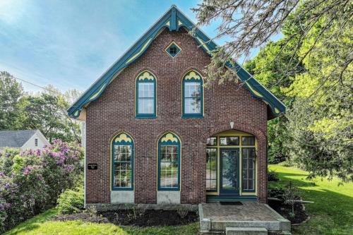 Elegant Victorian Gothic Revival home with wet bar, sunroom, & washer/dryer