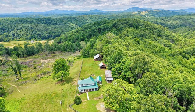 Escape to this spacious countryside retreat featuring beautiful mountain views, a wraparound porch.