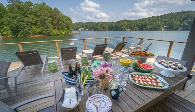 Lake Burton lakefront retreat with 4BR, hot tub, boat slip, and fire pit.