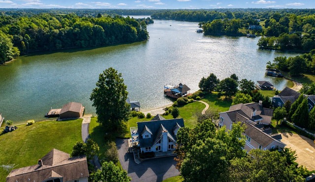 Lakefront retreat with views, hot tub, kid's play area, dock & fiber internet