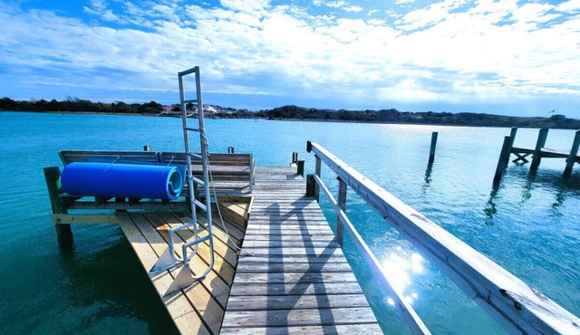Private cottage at the end of the road with hot tub, swim mat, kayaks, and a your private dock, 3 miles to the beach.