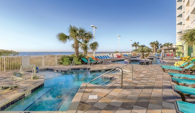 Relaxing Beachfront Getaway with Spacious 1BR at Towers on the Grove