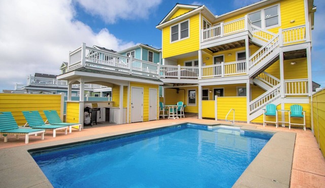 Semi-Oceanfront Home with a Large Pool Area, Cabana, and Rec Room by Sun Realty