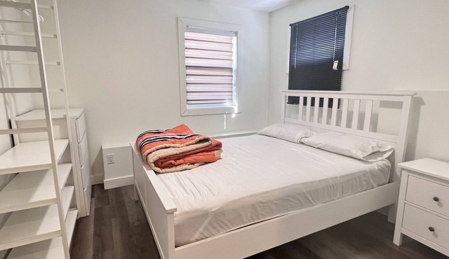 Spacious one bedroom basement apartment with 2 queen size beds &private entrance