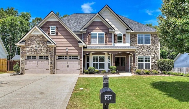 Stunning 4-Bedroom Retreat with Resort-Style Backyard in charming Evans.