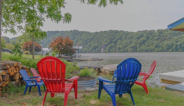 Waterfront retreat with private dock, wraparound deck & stunning lake views.