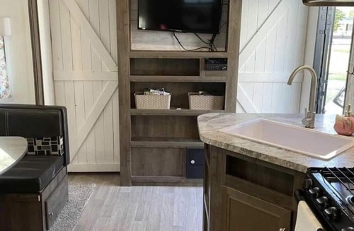 Aurora RV Rental | Camper located in campground! Walking distance to fishing!