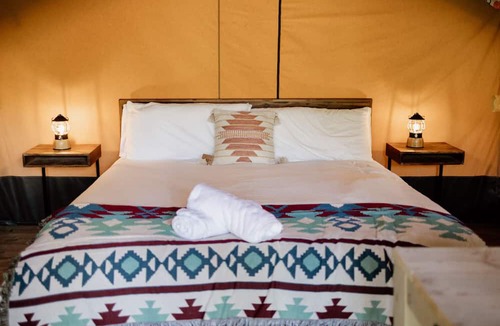 Woodstock RV Rental | Safari Tent Site 5 | 1 King Bed | Pond View