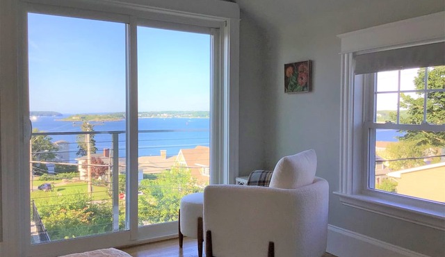 Distinguished classic coastal home overlooks Casco Bay and Maine’s rocky shore!