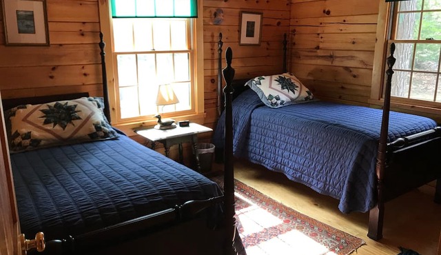 QUINTESSENTIAL MAINE LOG CABIN SET ON GORGEOUS LAKE