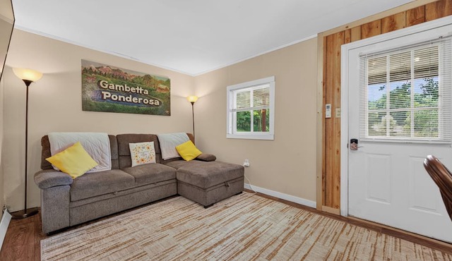 Cozy lakeside cabin with peaceful views, a covered porch, fire pit, and private rural getaway.